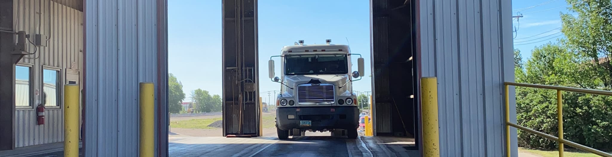 Semi truck driving into a garage